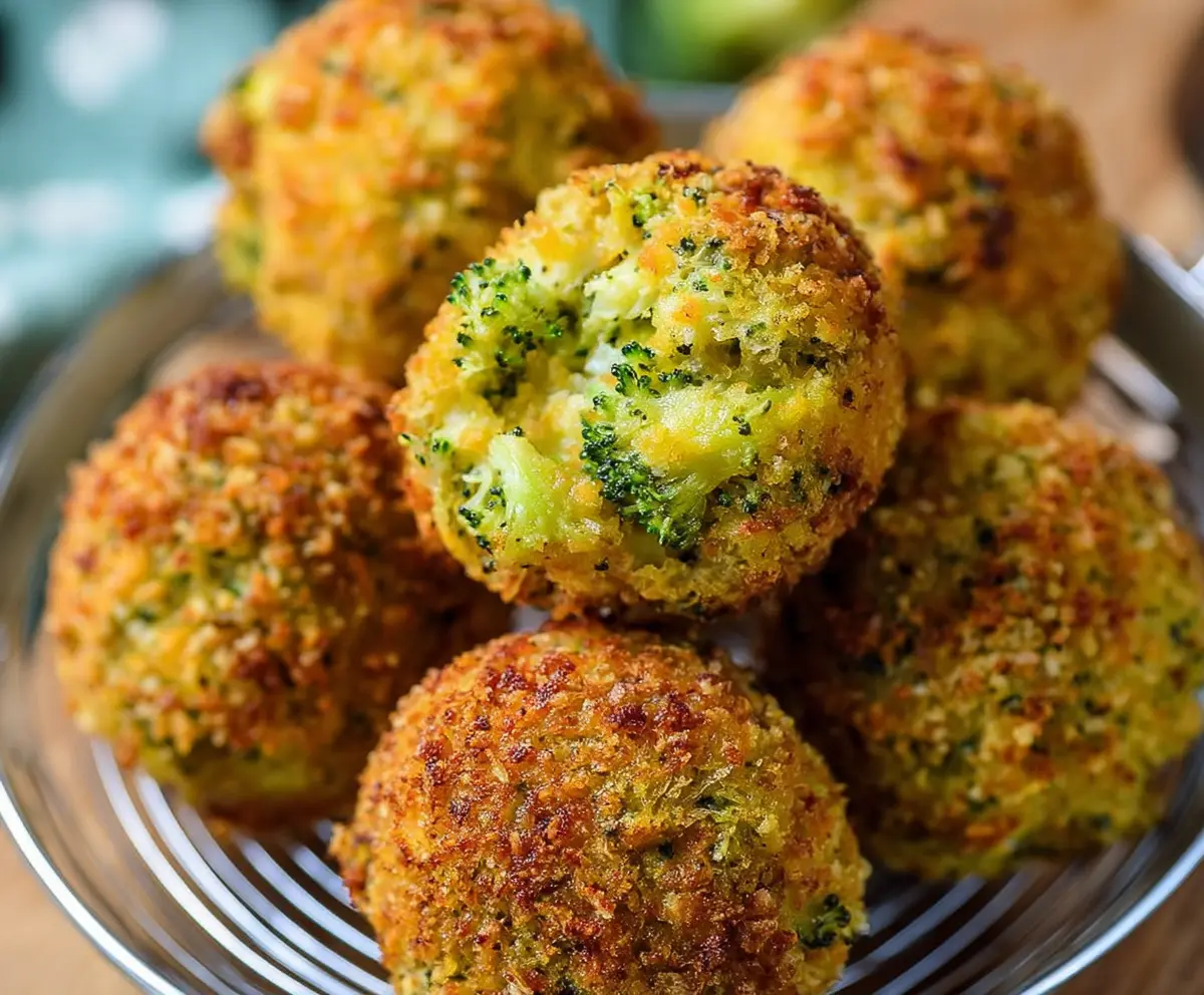 Delicious baked broccoli cheese balls served on a platter, crispy and golden brown.