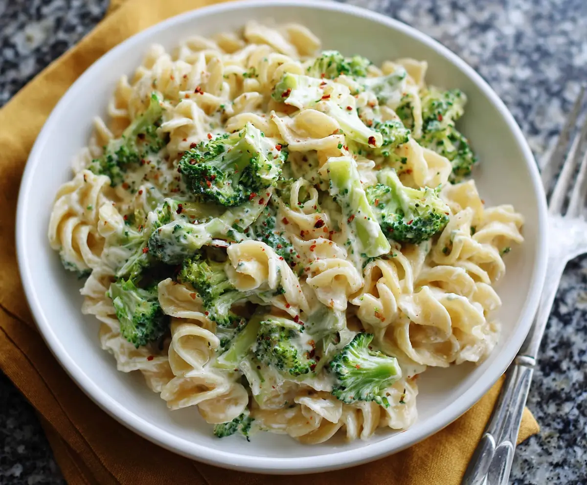Creamy Boursin cheese pasta with fresh broccoli florets, served as a delicious and easy-to-make meal.