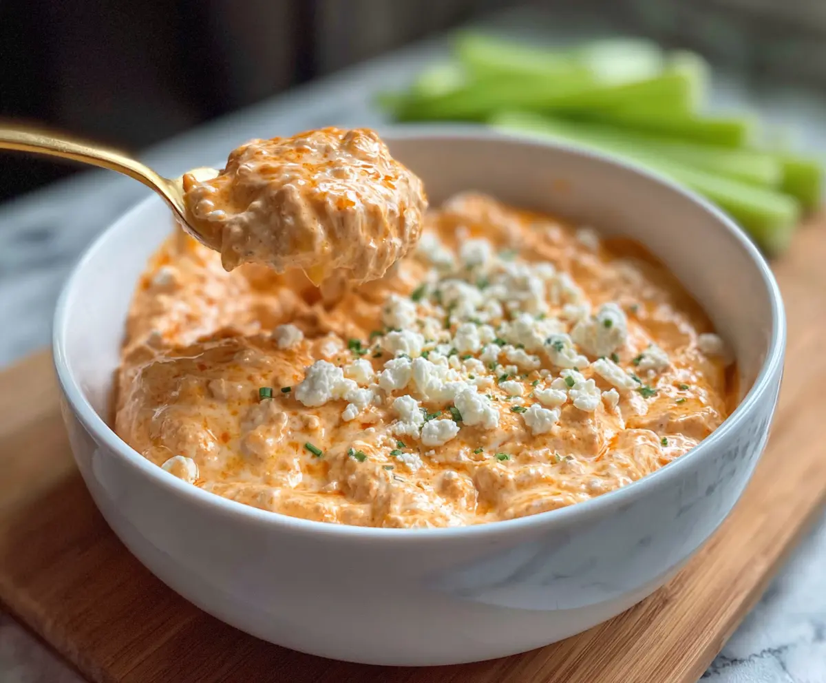 Healthy Buffalo Chicken Cottage Cheese bowl with spicy buffalo sauce and fresh toppings