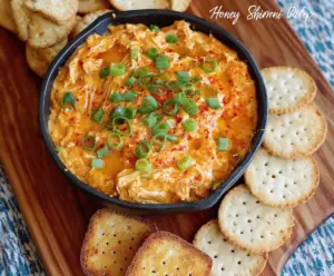 Delicious Honey Sriracha Chicken Dip served with crispy chips on a colorful platter