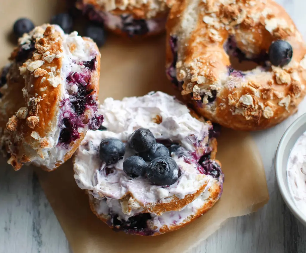 Delicious Greek Yogurt Blueberry Crunch Bagels showcasing fresh blueberries and crunchy topping.
