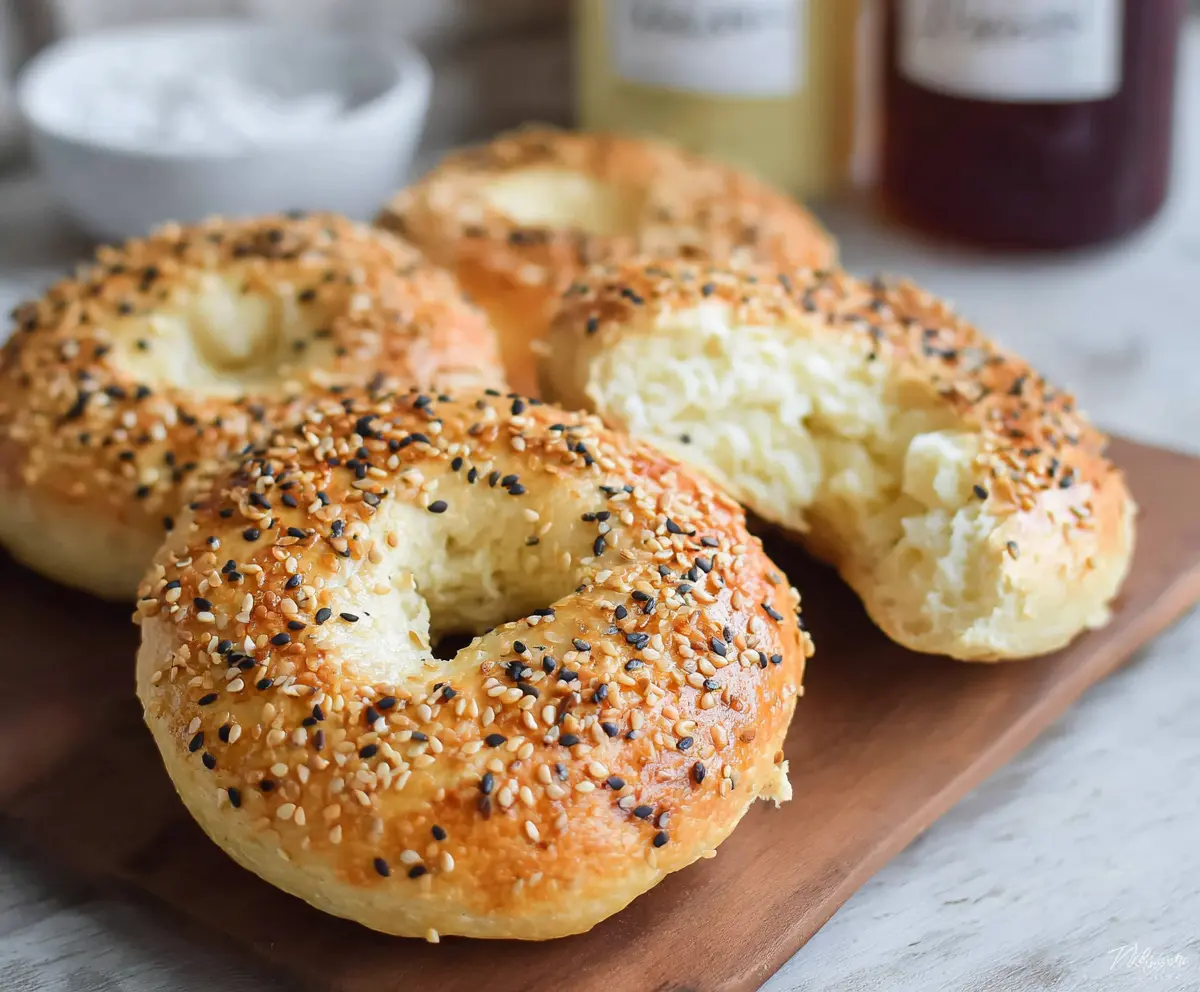 Delicious gluten-free cottage cheese bagels on a white plate, perfect for a healthy breakfast.