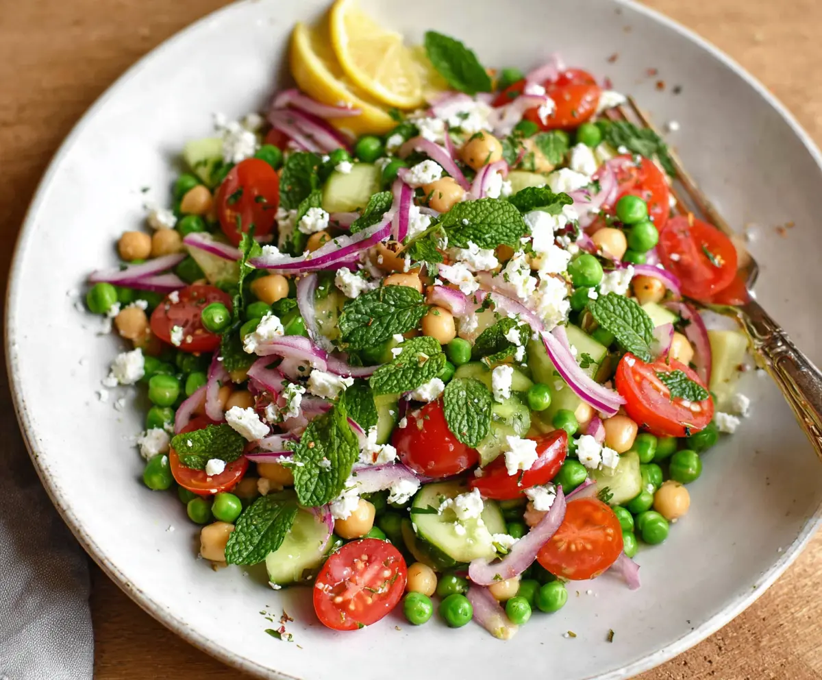 Colorful Mediterranean Pea Salad with fresh vegetables and herbs, perfect for healthy eating.